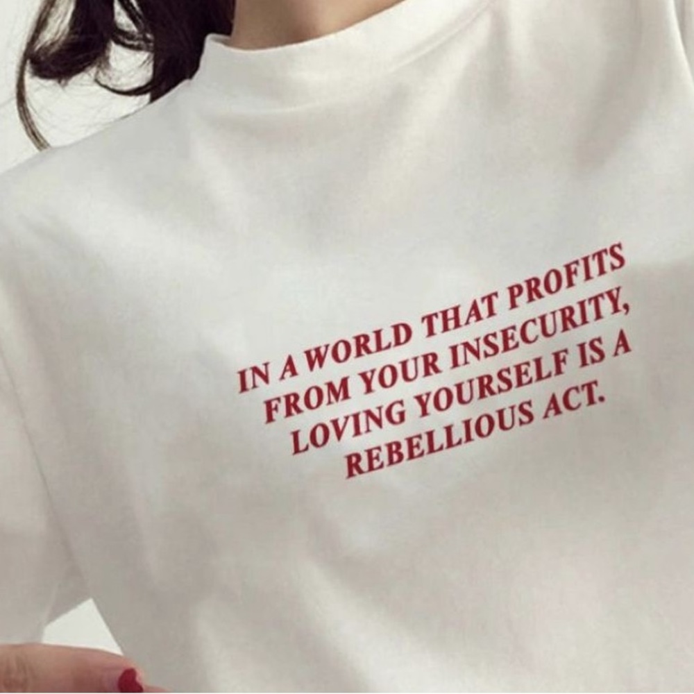 In A World That Profits From Insecurity Graphic T Shirt